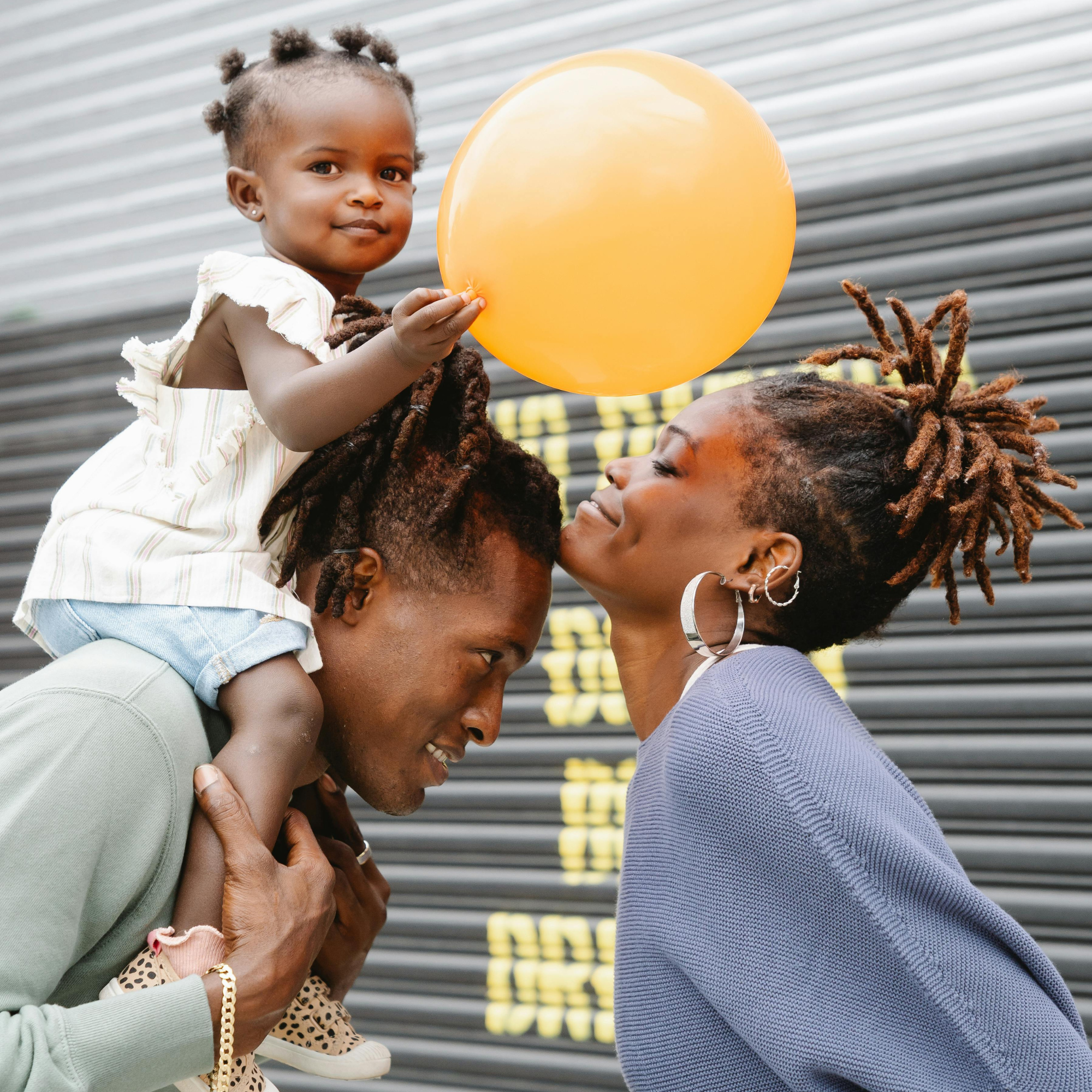 happy family playing with balloon