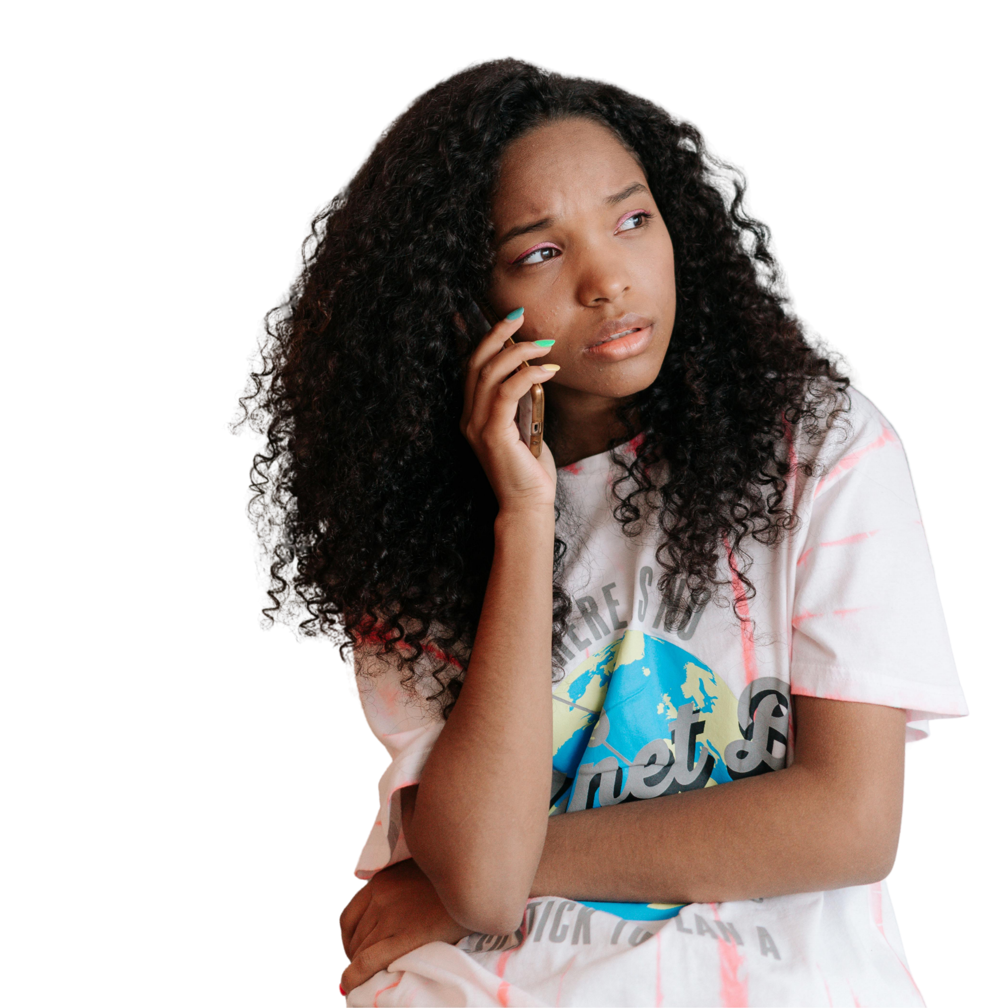 teen girl looks stressed out on phone