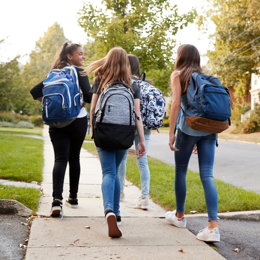teens look happy walking home from school